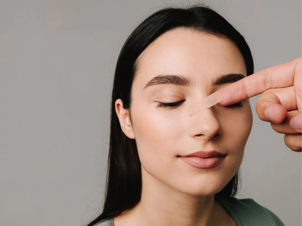 a woman's nose getting a recovery stitching
